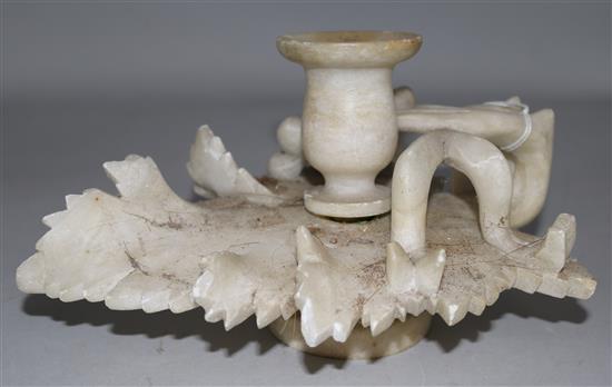 An alabaster candle holder